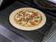 Set pietra rotonda e pala in legno per pizza